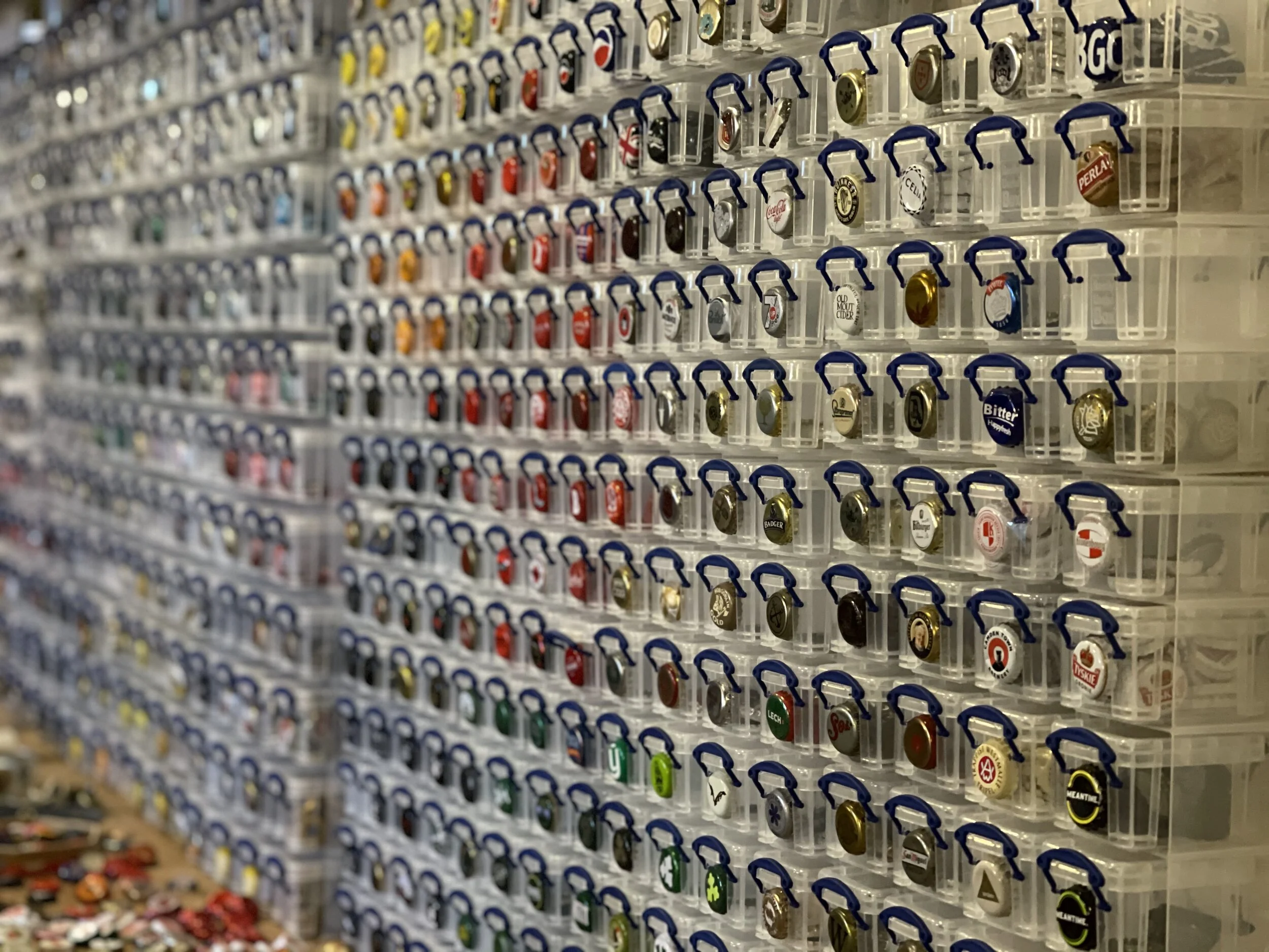  Before designing, I collect, clean and systematically arrange the bottletops into carefully chosen groups depending on colour and brand.  