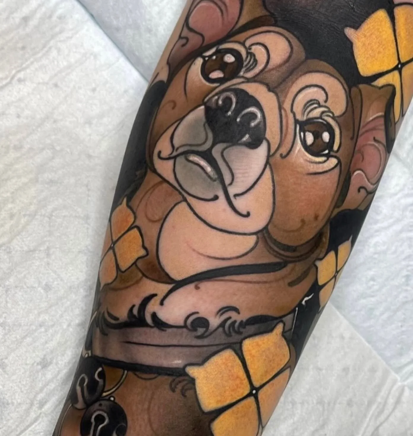 Neo-traditional pug tattoo with flowers by Gia Rose