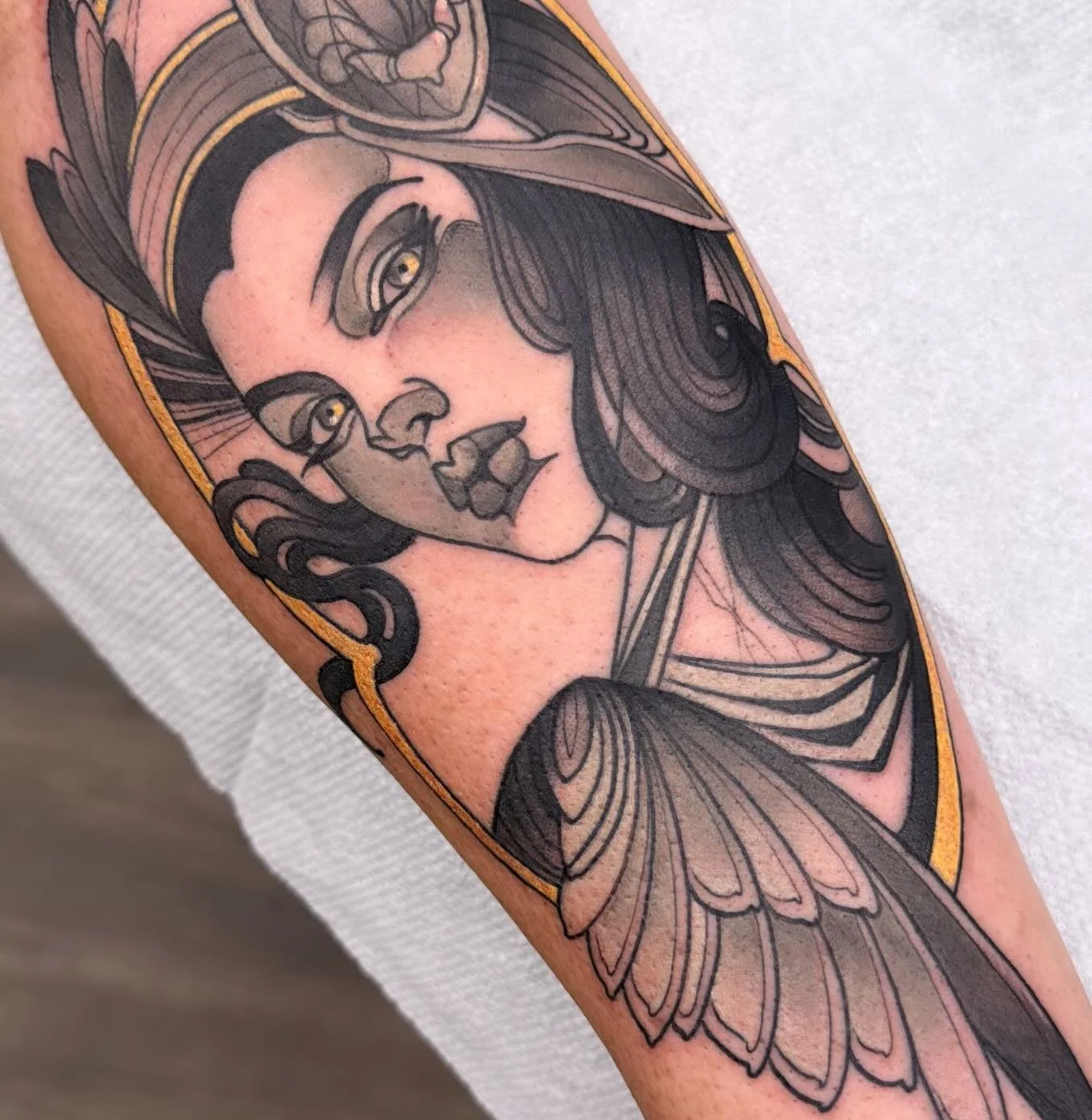 Angel tattoo with gold accents by Gia Rose