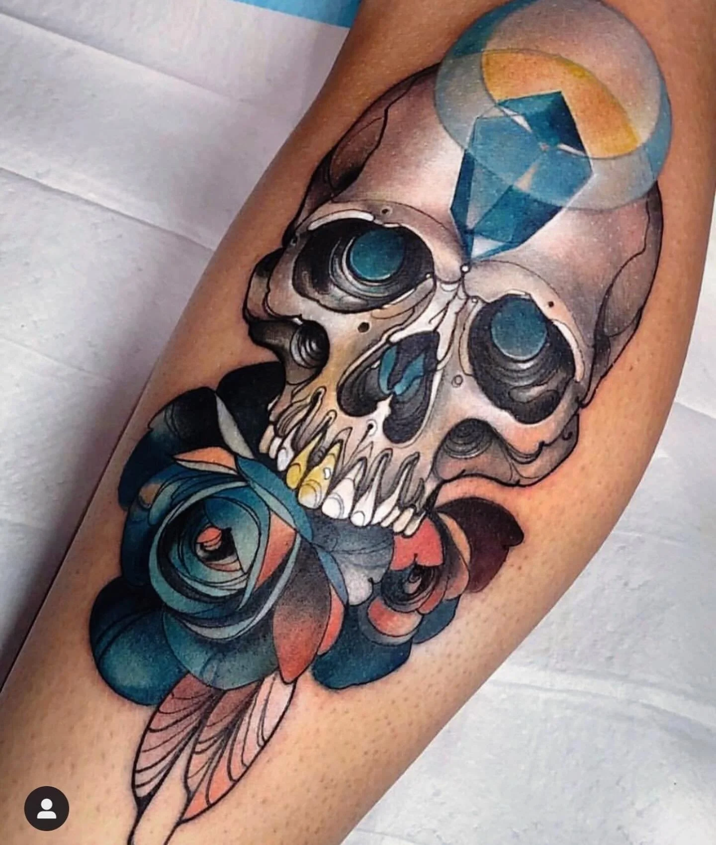 Skull and blue rose tattoo by Gia Rose