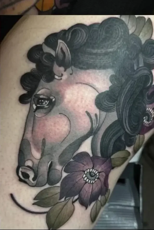 Horse with flowers tattoo