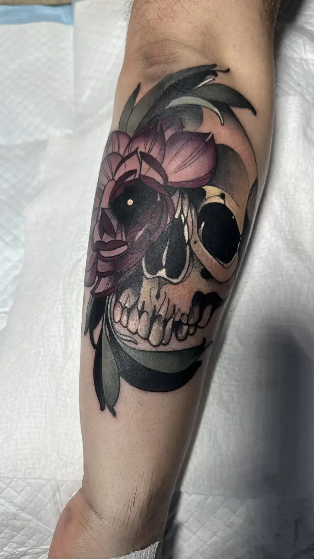 Skull and peony tattoo
