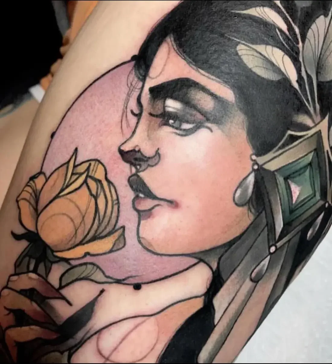 The Rose, Held tattoo — lady in profile holding a gold rose against a pink moon