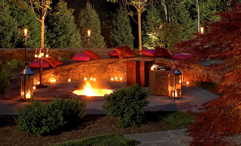 Custom stone firepit at night