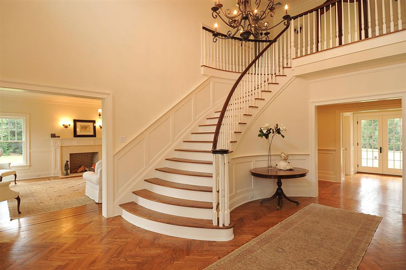 Open foyer with flat panel wainscoting