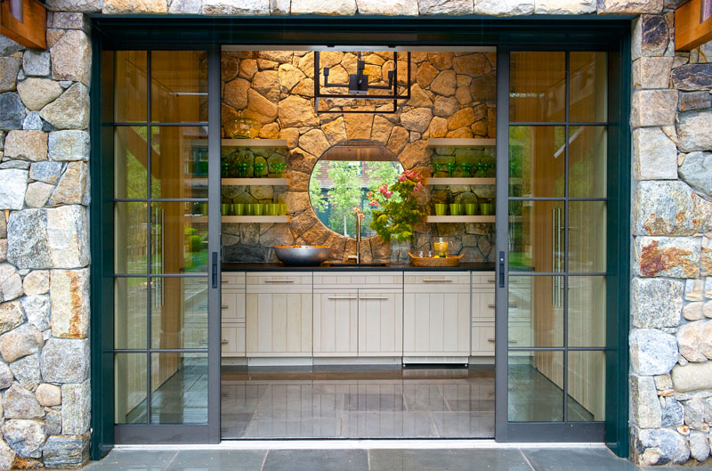Custom cabinetry in stone pool house