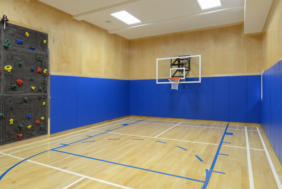 Half-court basketball with badminton & rock climbing wall
