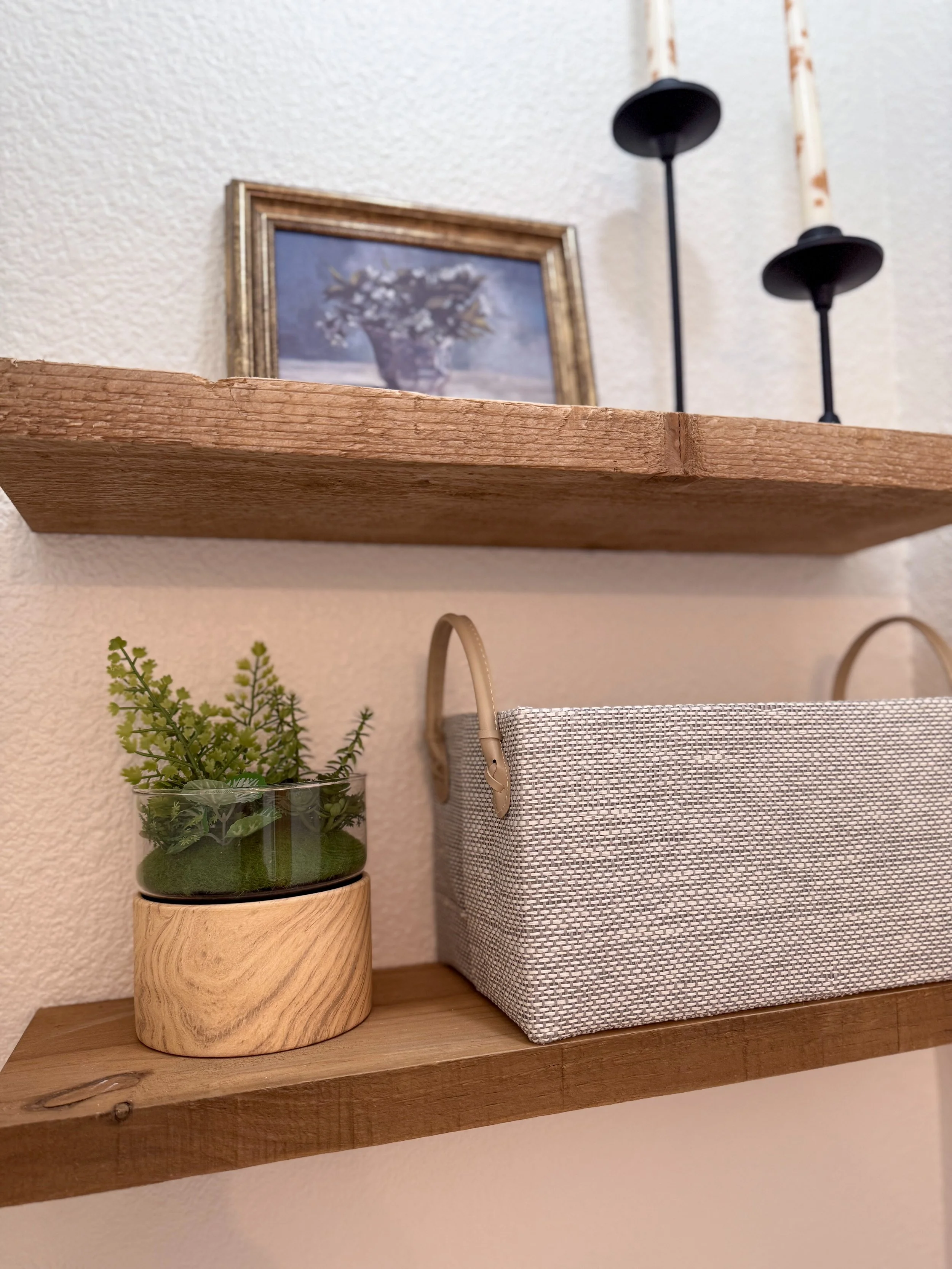 primary bathroom remodel, earthy bathroom inspiration, shower and bathtub combo, shower system with handheld sprayer, double vanity, wood vanity, floating shelves, arched medicine cabinets, toilet paper niche, double light sconce, brass finishes