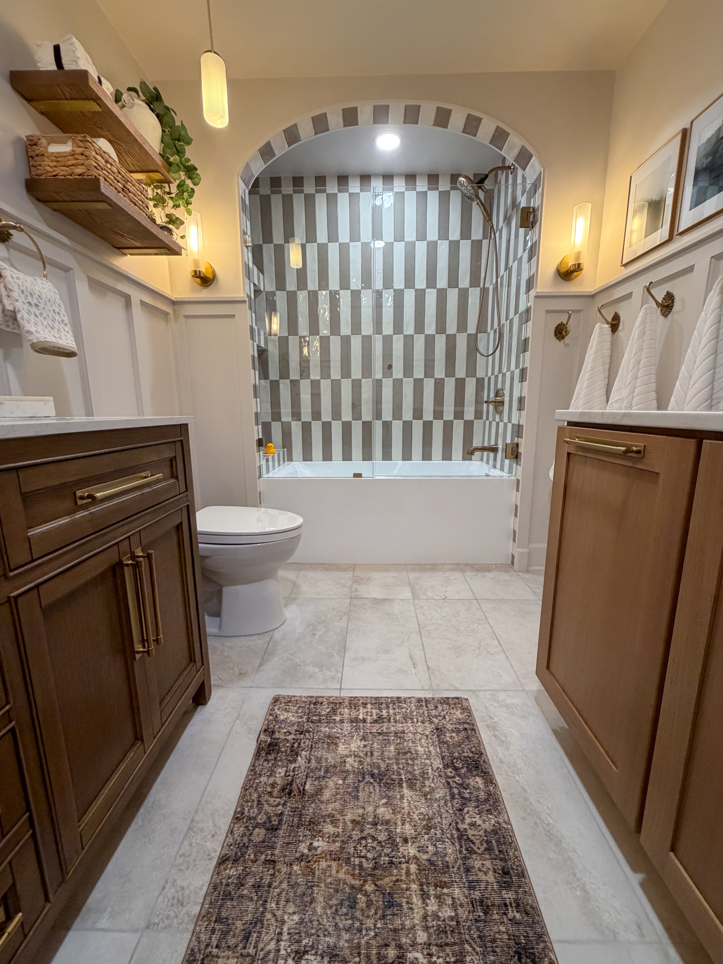 kids bathroom renovation, modern traditional bathroom, transitional bathroom design, family bathroom remodel, bathroom tile design ideas, bathroom storage solutions, interior design bathroom, timeless bathroom design, durable bathroom, arched shower