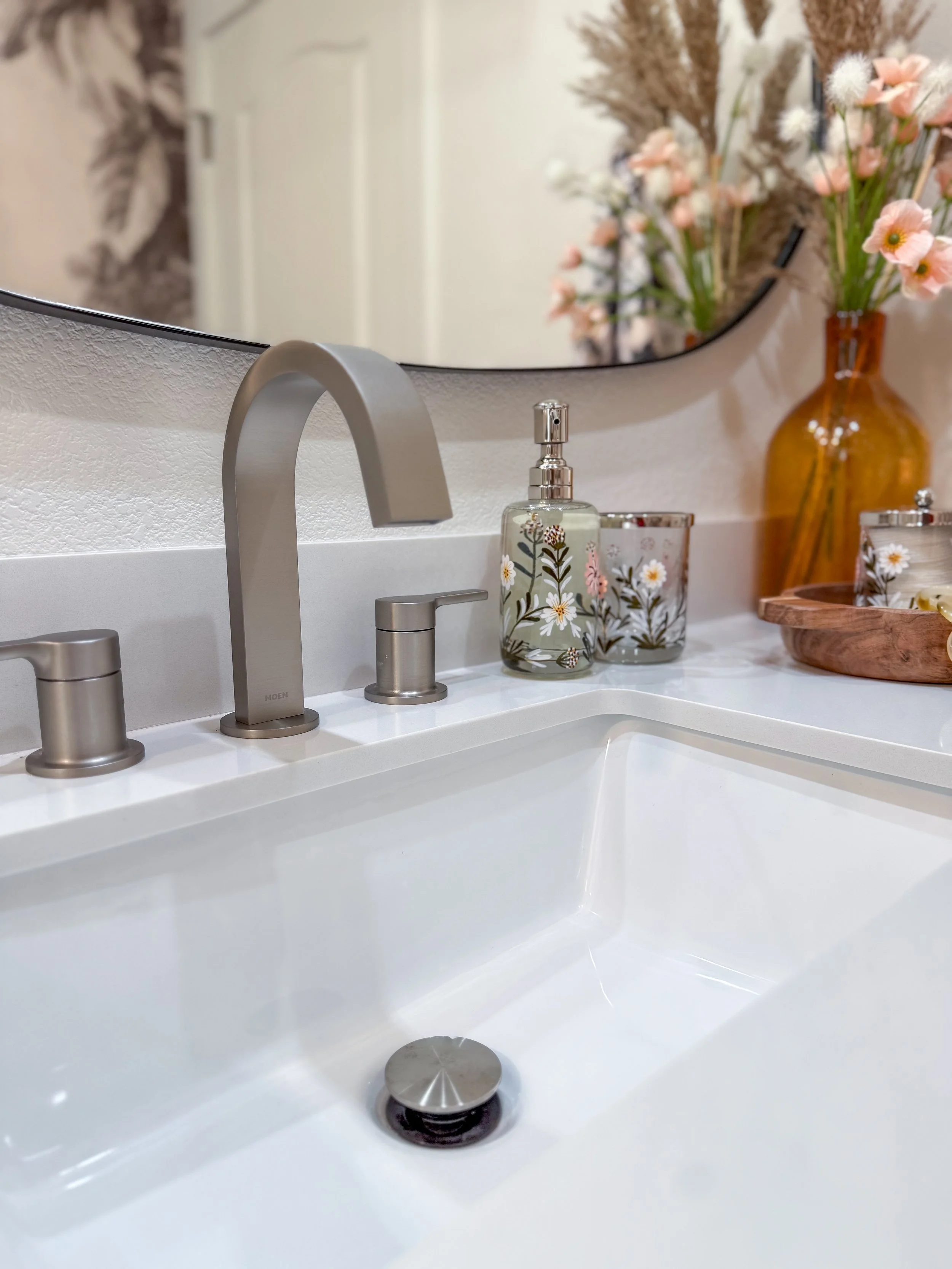 bathroom remodel, contemporary, renovation, vanity, single sink vanity, pendant lighting, hanging lighting, contemporary mirror, bathroom wall removal, brushed nickel, hardware mix, black hardware, bathroom decor, flower tile, wallpaper, bold
