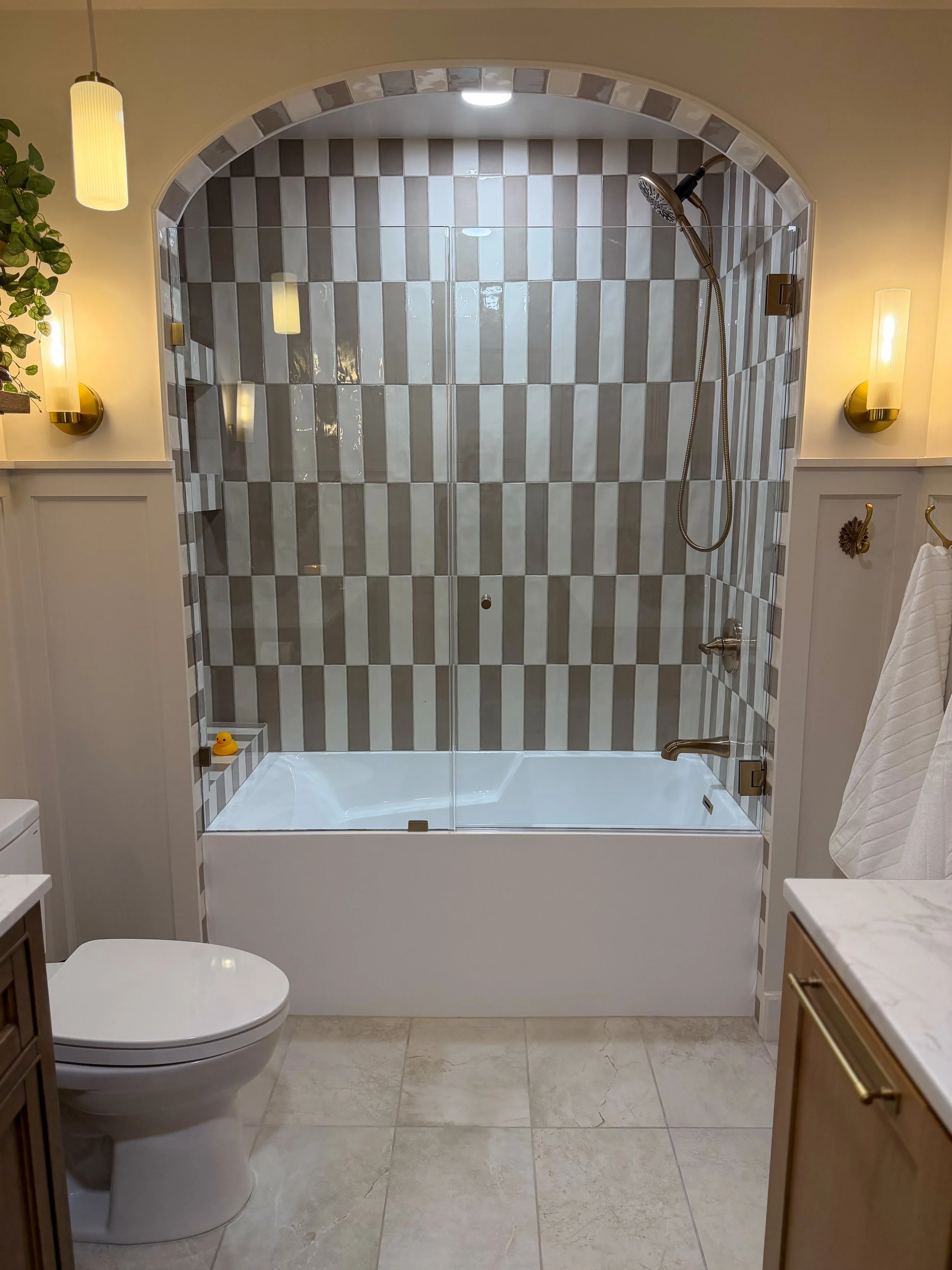 kids bathroom renovation, modern traditional bathroom, transitional bathroom design, family bathroom remodel, bathroom tile design ideas, bathroom storage solutions, interior design bathroom, timeless bathroom design, durable bathroom, arched shower