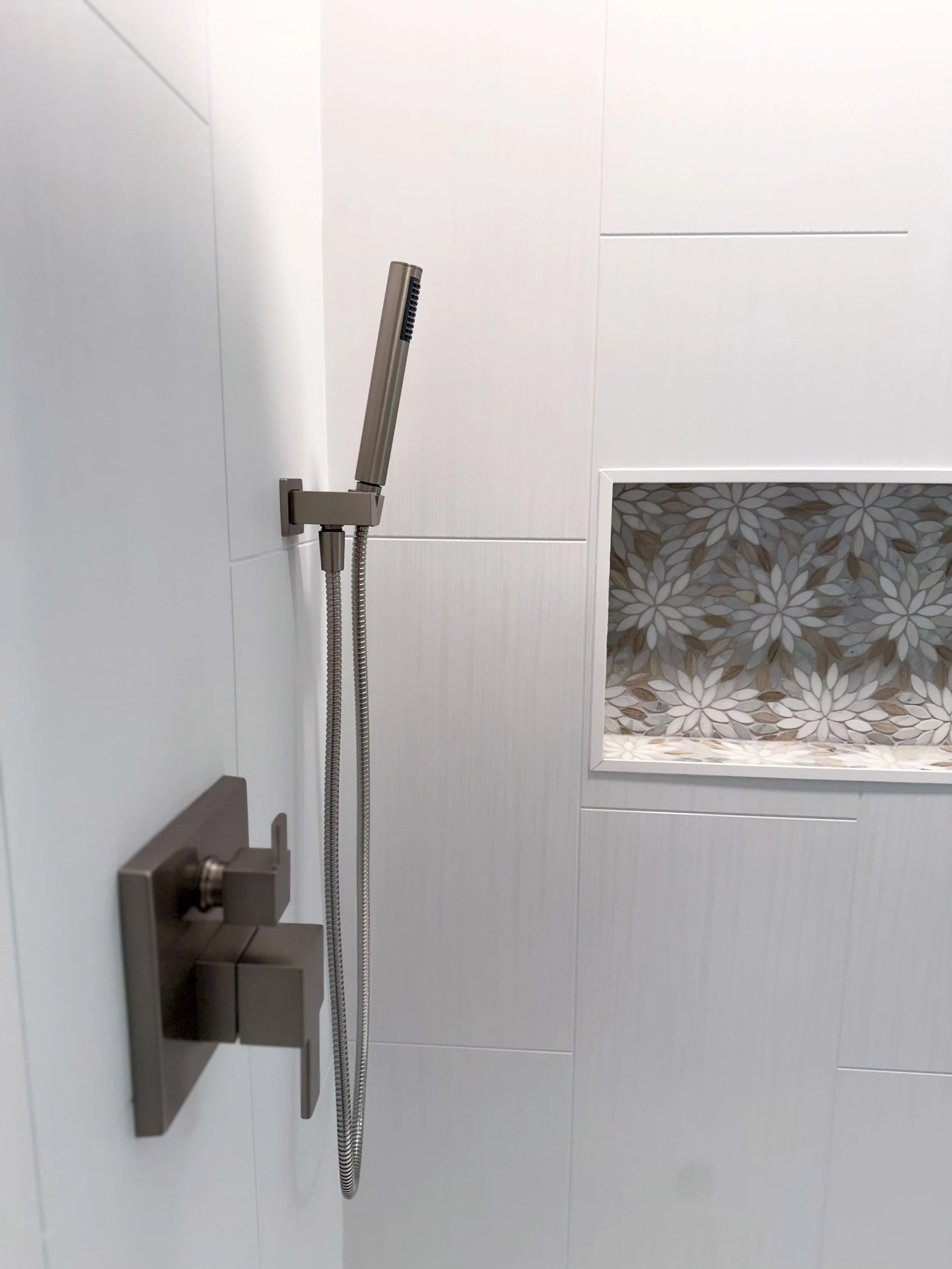 bathroom remodel, contemporary, renovation, vanity, single sink vanity, pendant lighting, hanging lighting, contemporary mirror, bathroom wall removal, brushed nickel, hardware mix, black hardware, bathroom decor, flower tile, wallpaper, bold