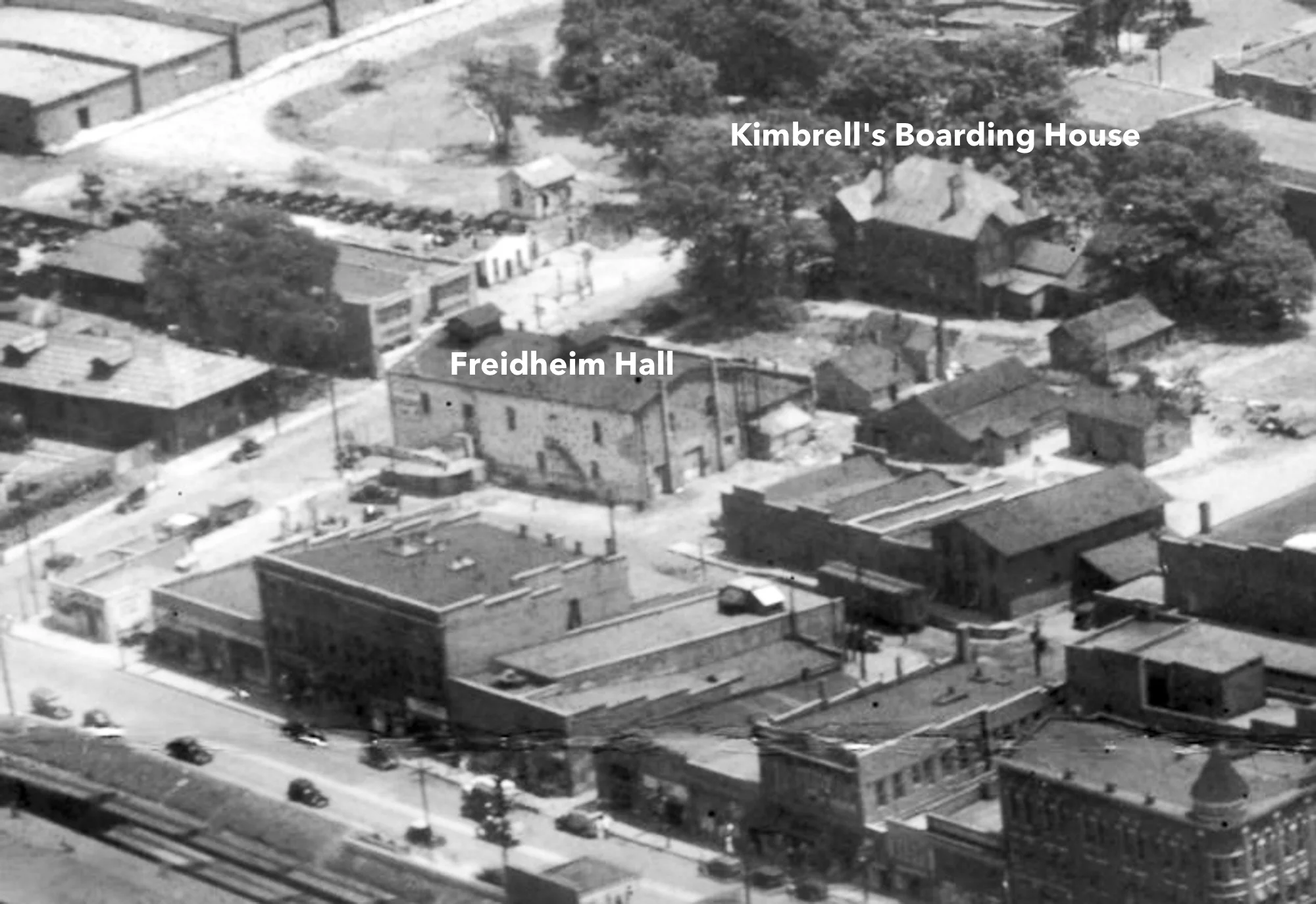 Aerial view showing Kimbrell's Boarding house across the street from Freidheim Hall