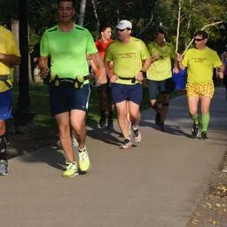 Coach Brendan in action wearing his signature chili pepper running shorts! Top Photo: Coach Brendan in Antartica 