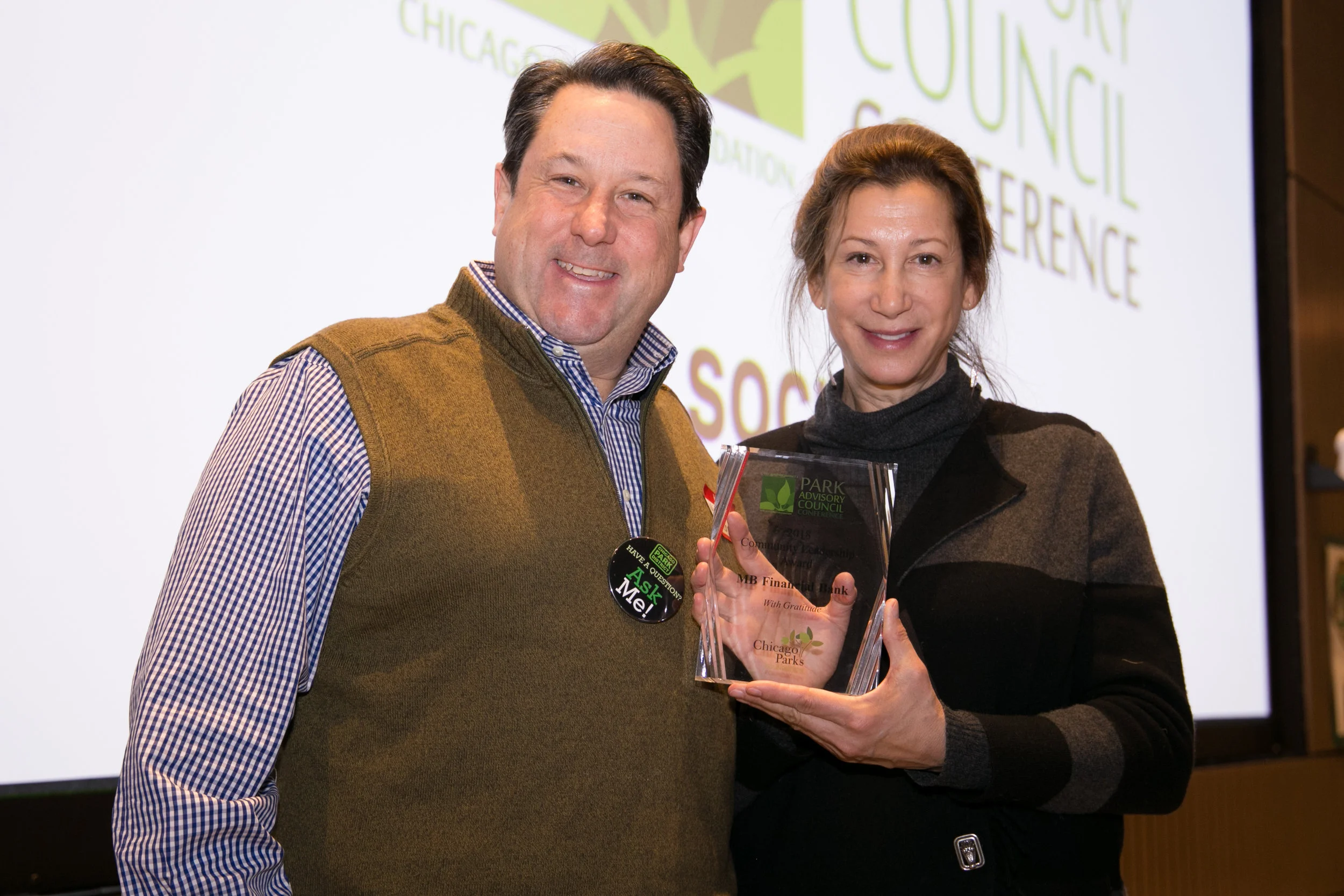 MB Financial Bank's Michael Smith, who also chairs the CPF Board of Directors, accepts the Community Leadership Award on behalf of MB from CPF Executive Director Willa Lang 