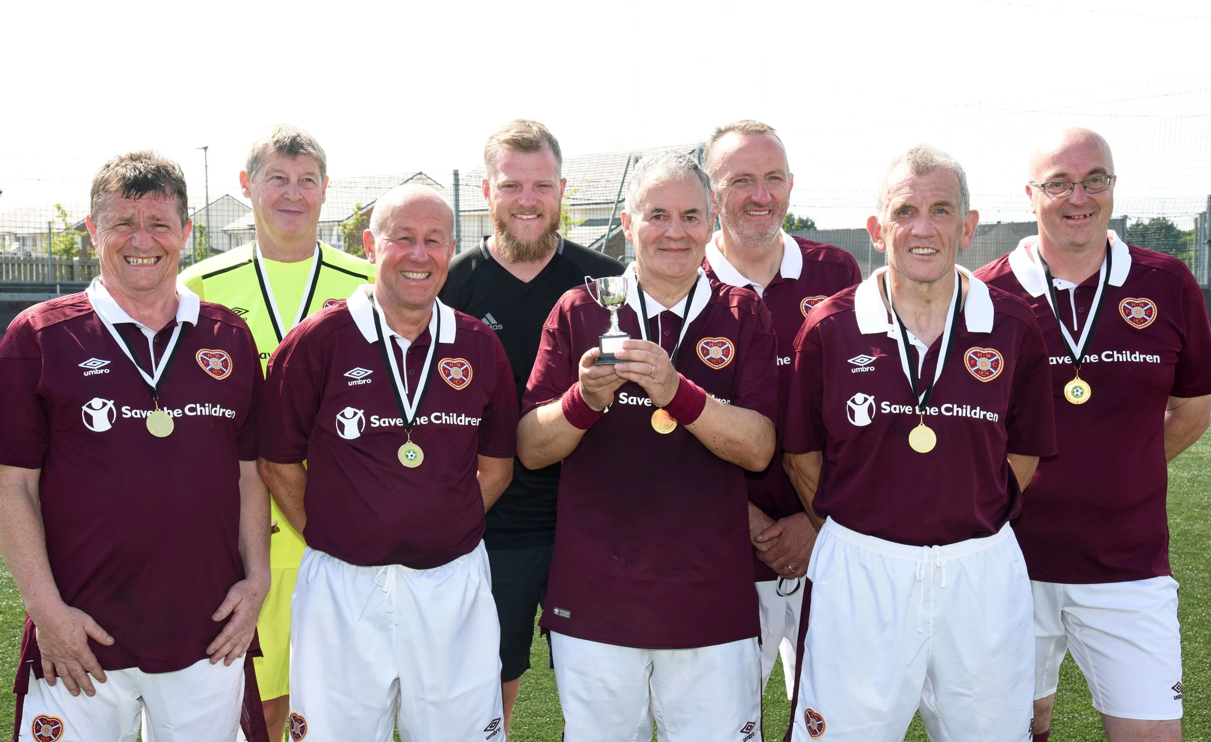Heart of Midlothian captain Jimmy Bremner received the AUFA Trophy from Jason Butler.