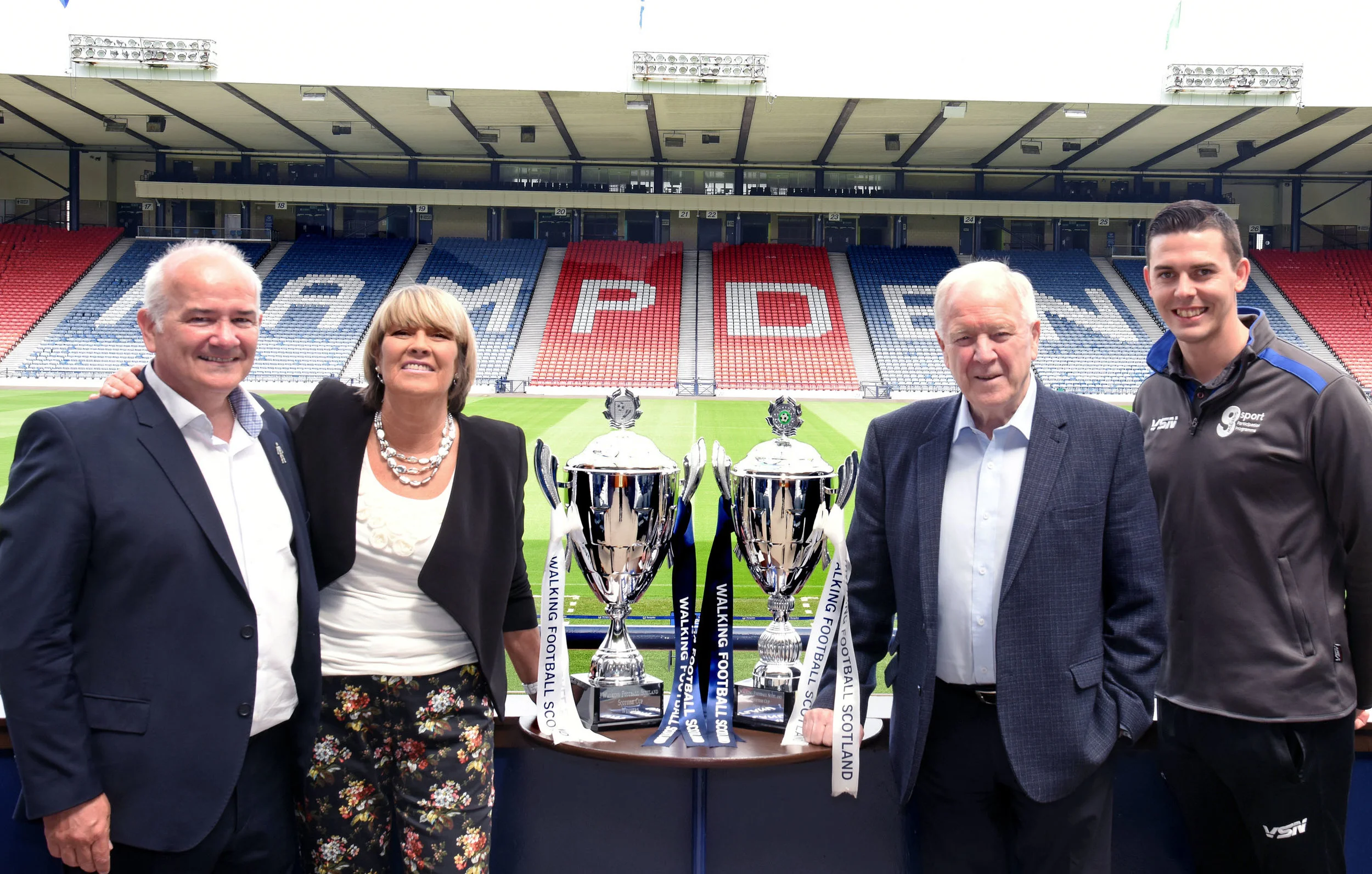 l-r Gary McLaughlin and Rose Reilly beside the Over 50’s Scottish Cup, Craig Brown and Matt Ramsay closest to the new Over 65’s Scottish Cup