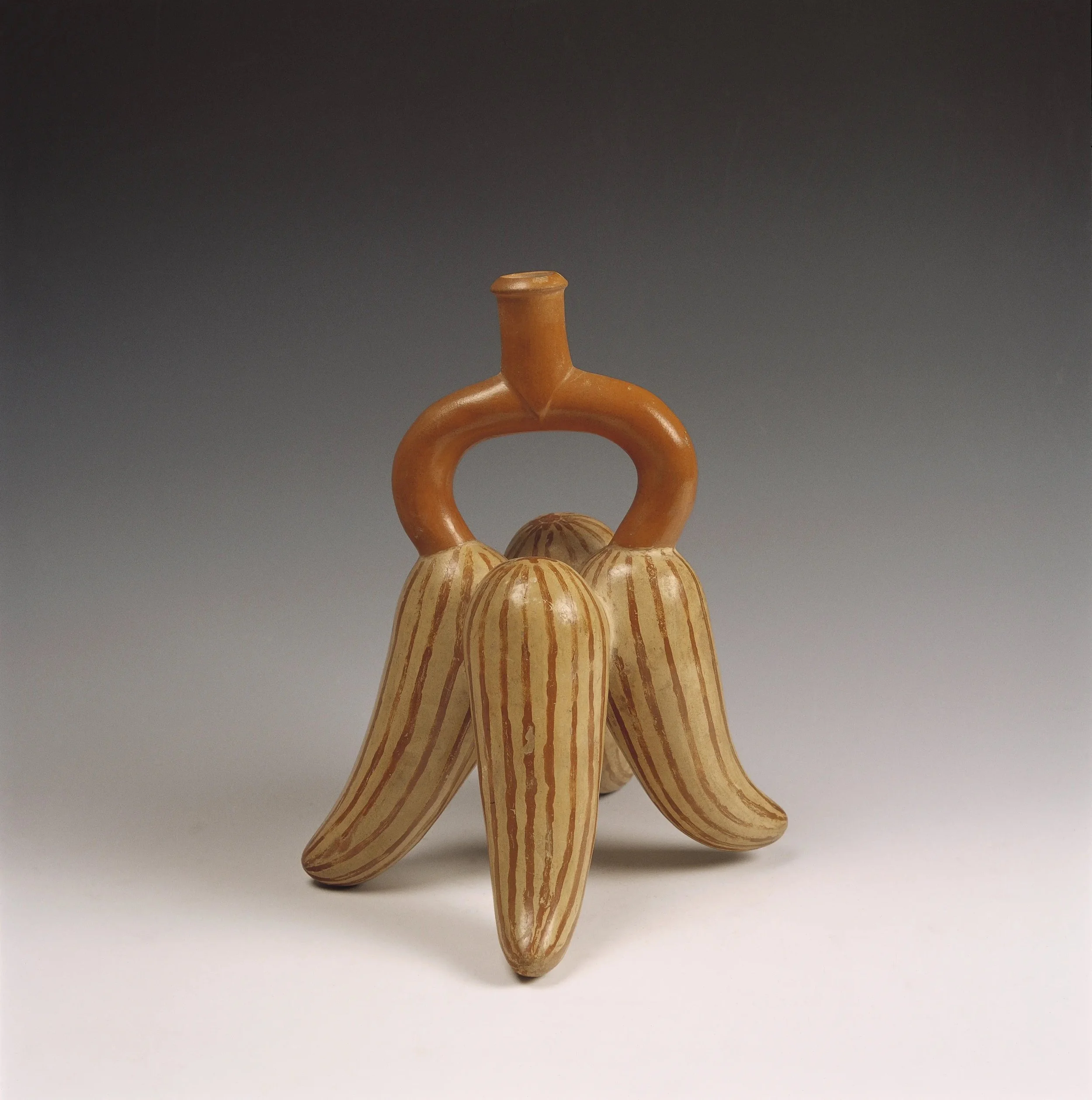 Moche sculptural ceramic stirrup-spout bottle from Pedregal in the Moche Valley, North Coast of Peru.