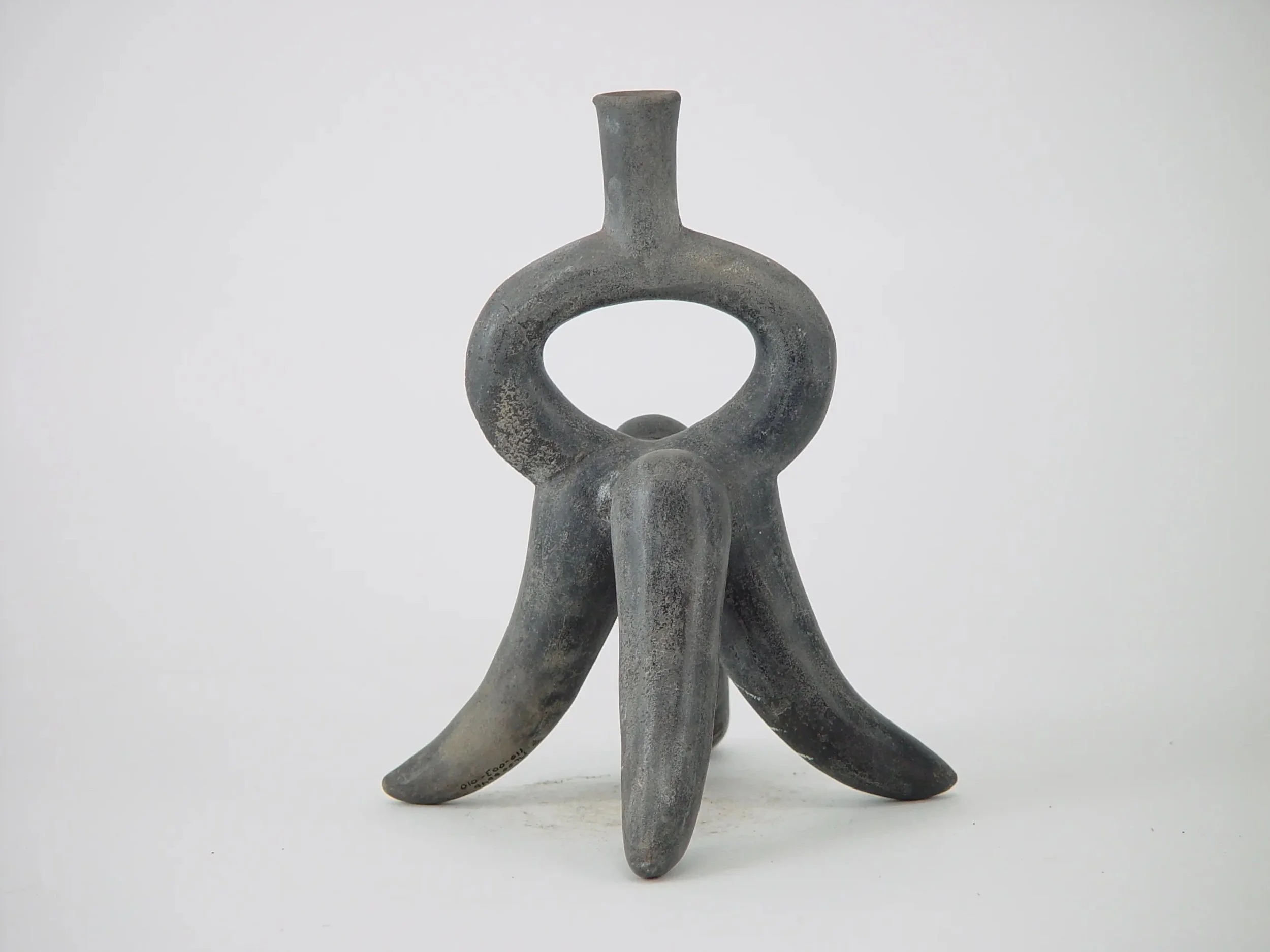 Moche sculptural ceramic stirrup-spout bottle from the North Coast of Peru.