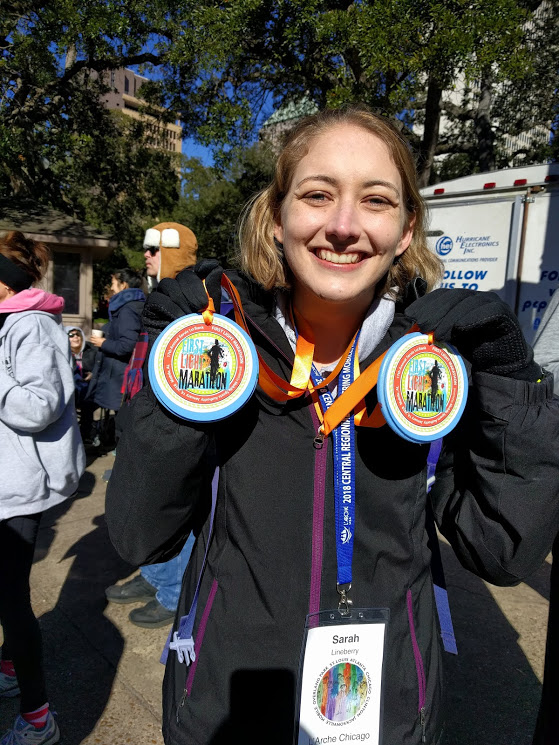 Sarah ran the half marathon and got two medals!