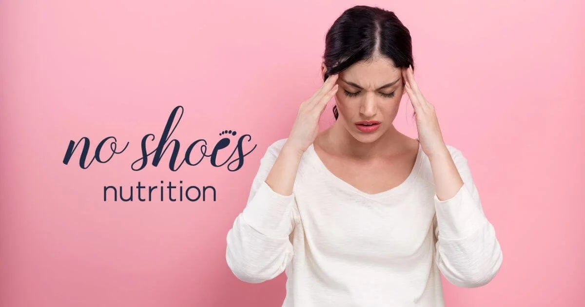 Stresses woman with hands at temples on a pink background and No Shoes Nutrition logo.
