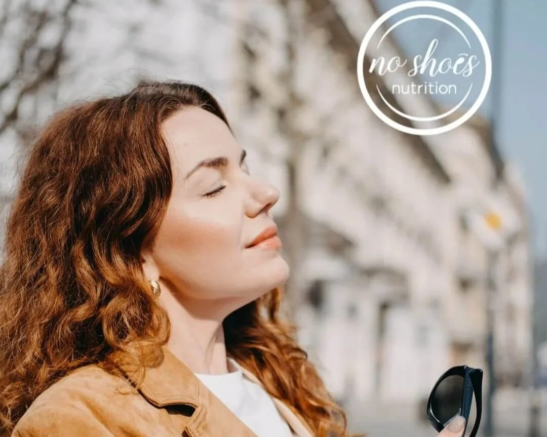 A woman basking in the sun to reset her nervous system.