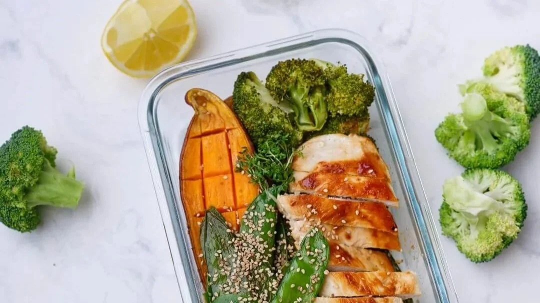 A prepped meal in a glass container ready for a busy work week.