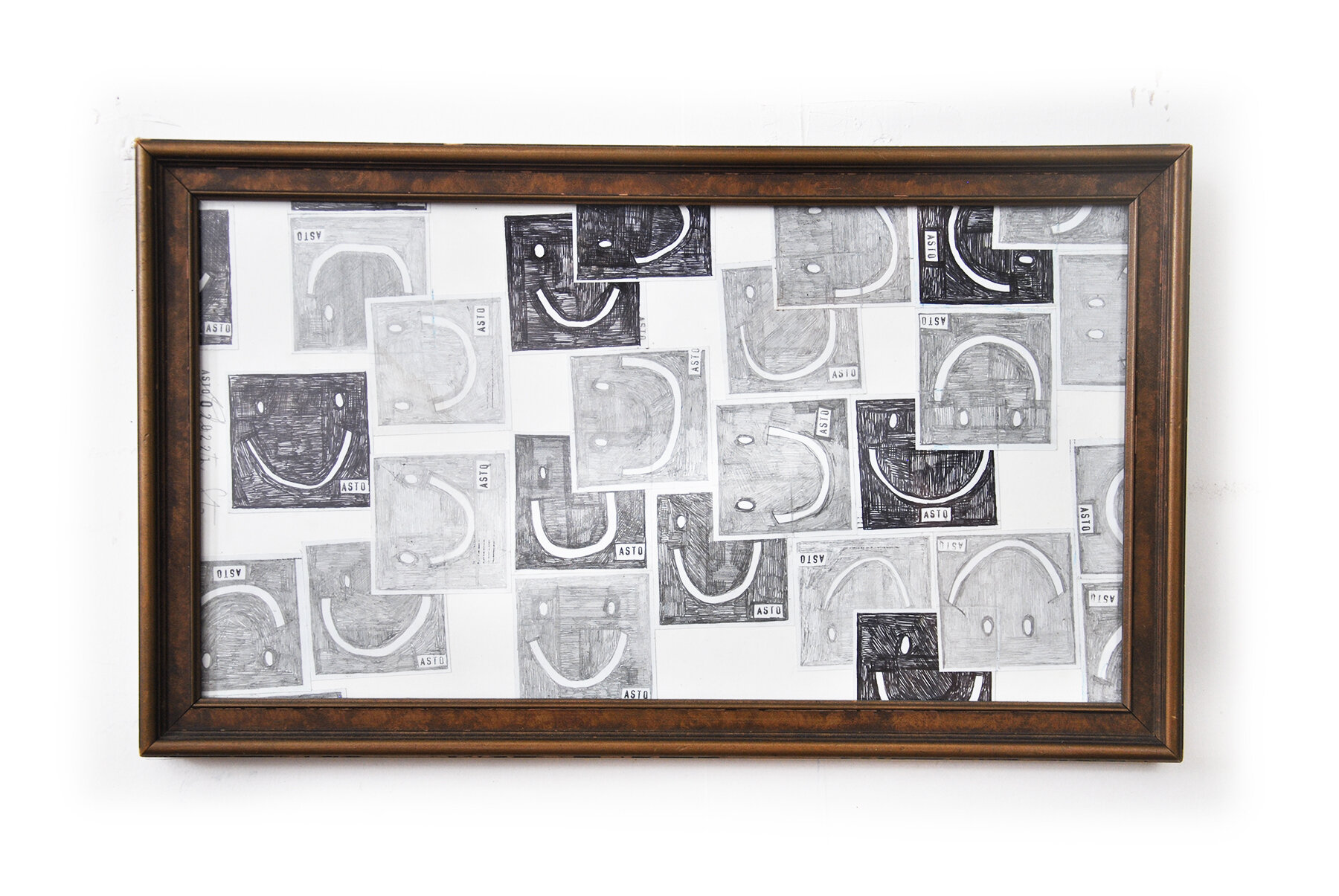   SMILING FACES 4  Graphite, Glue on  Paper Wood frame and Glass 10.5” x 18” 2020 