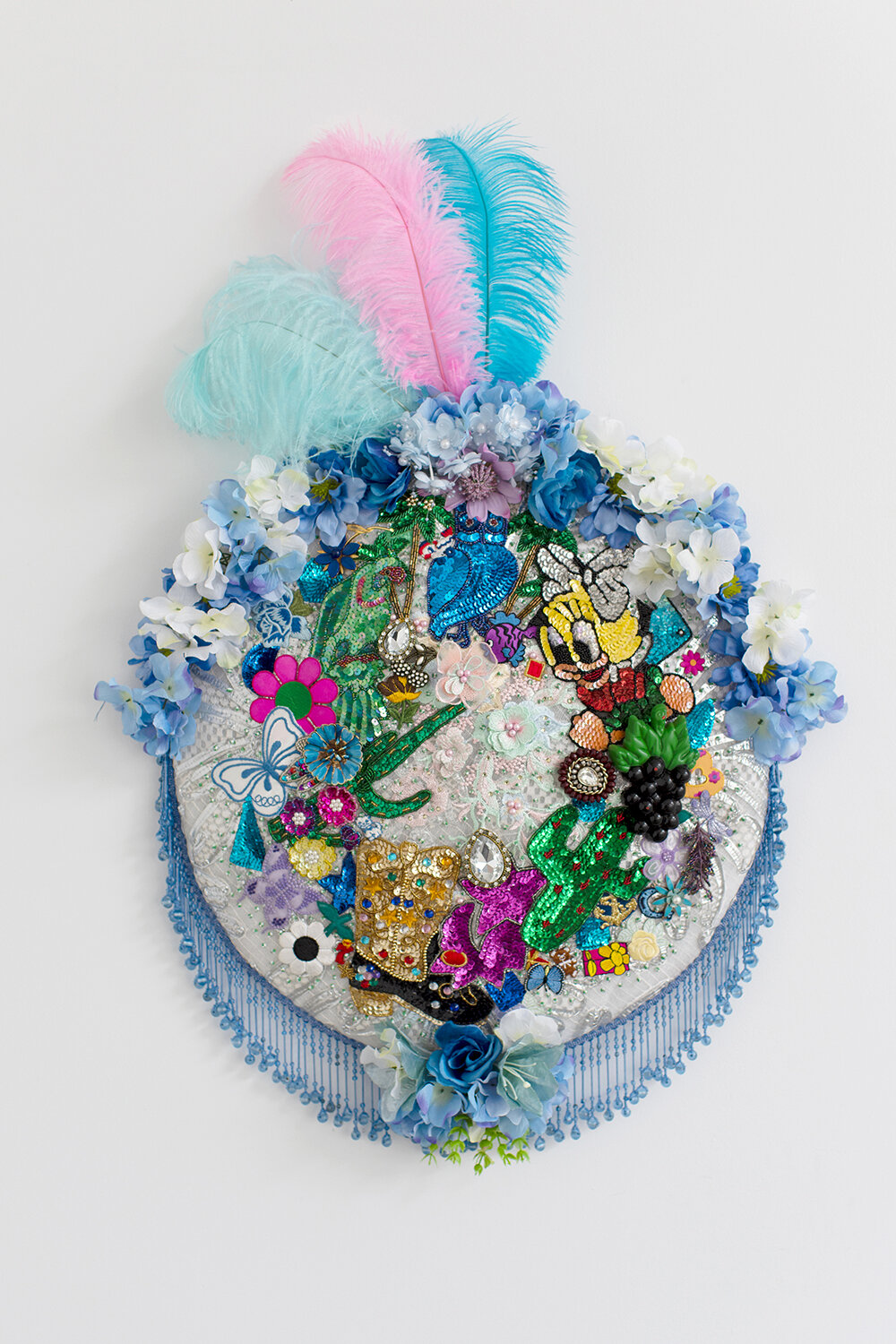   Elegy #5 , 2019, Crystal and plastic beads, sequin patches, found fabric, trim, fabric flowers, magnets, ostrich feathers, polyester batting, composite board, thread, 38 x 25 x 5” 