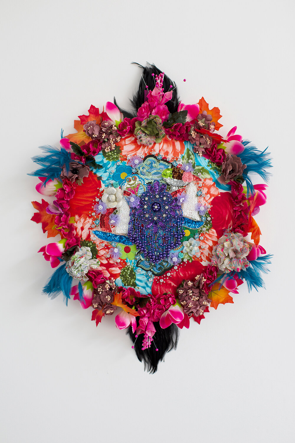   Elegy #12 , 2019, Crystal and plastic beads, sequin patches, found fabric, trim, fabric flowers, feathers, polyester batting, MDF, thread, 25 x 20 x 5” 