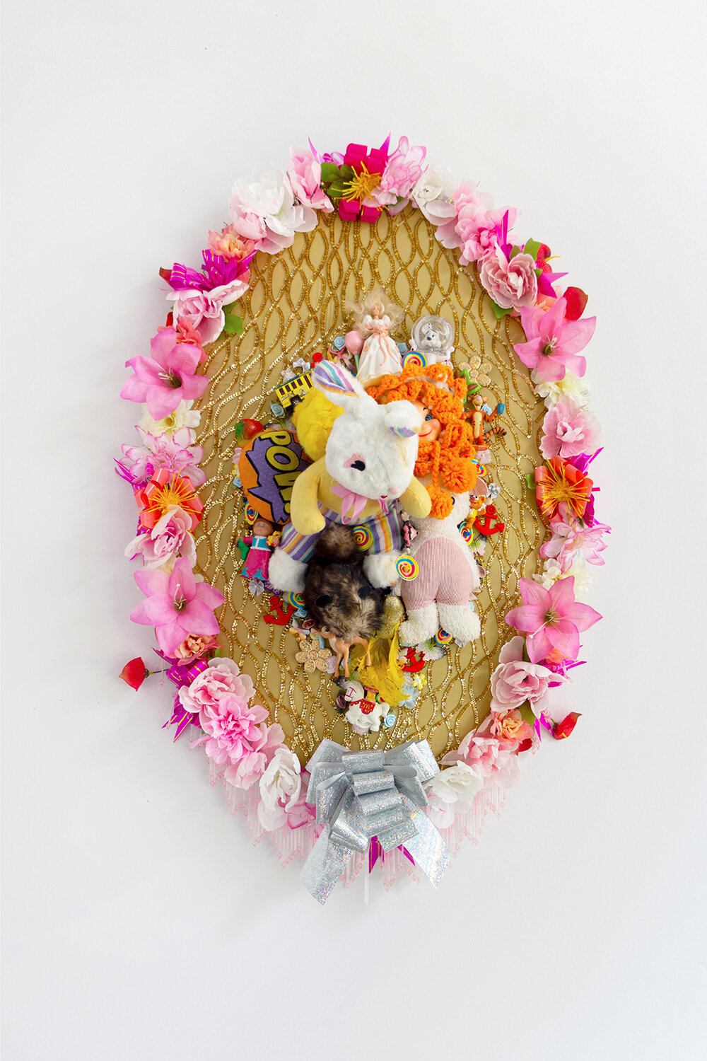   Elegy #17 , 2020, Found fabric, trim, fabric flowers, ribbon, patches, toys, garland, polyester batting, MDF, thread, 40 x 30 x 15” 