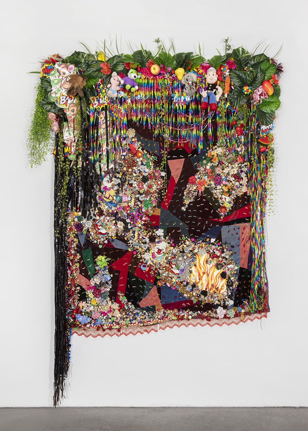   Shroud #1,  2021, Found ‘Crazy’ quilt ca. 1910, trim, fabric flowers, streamers, banners, garland, paper cut-outs, toys, ribbon, costume jewelry, buttons, plastic flowers, fauna, and fruit, beads, sequins, thread, fabric, Douglas fir, 114 x 78 x 12