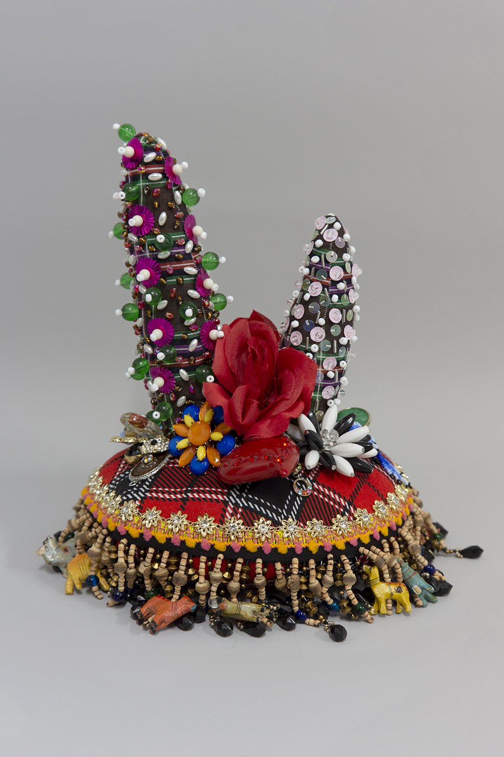   Untitled,  2022, Crystal and plastic beads and sequins, found fabric, trim, fabric flowers, costume jewelry, polyester batting, thread, 10.5 x 9.5 x 8.5” 