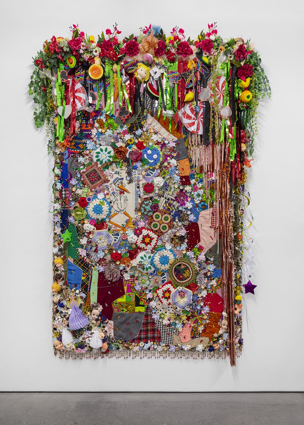   Shroud #7 , 2022, Found ‘Crazy’ quilt ca. 1950, trim, fabric flowers, streamers, banners, garland, crochet pot holders, paper cut-outs, toys, ribbon, costume jewelry, buttons, plastic flowers, fauna, and fruit, beads, sequins, thread, fabric, Dougl