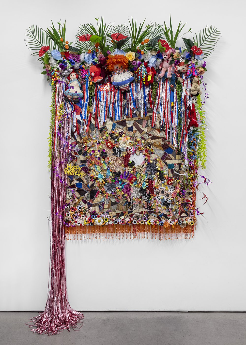   Shroud #8 , 2022, Found ‘Crazy’ quilt ca. 1900, trim, fabric flowers, streamers, banners, garland, paper cut-outs, toys, ribbon, costume jewelry, buttons, plastic flowers and fauna, beads, sequins, thread, fabric, Douglas fir, 95 x 63 x 12” 