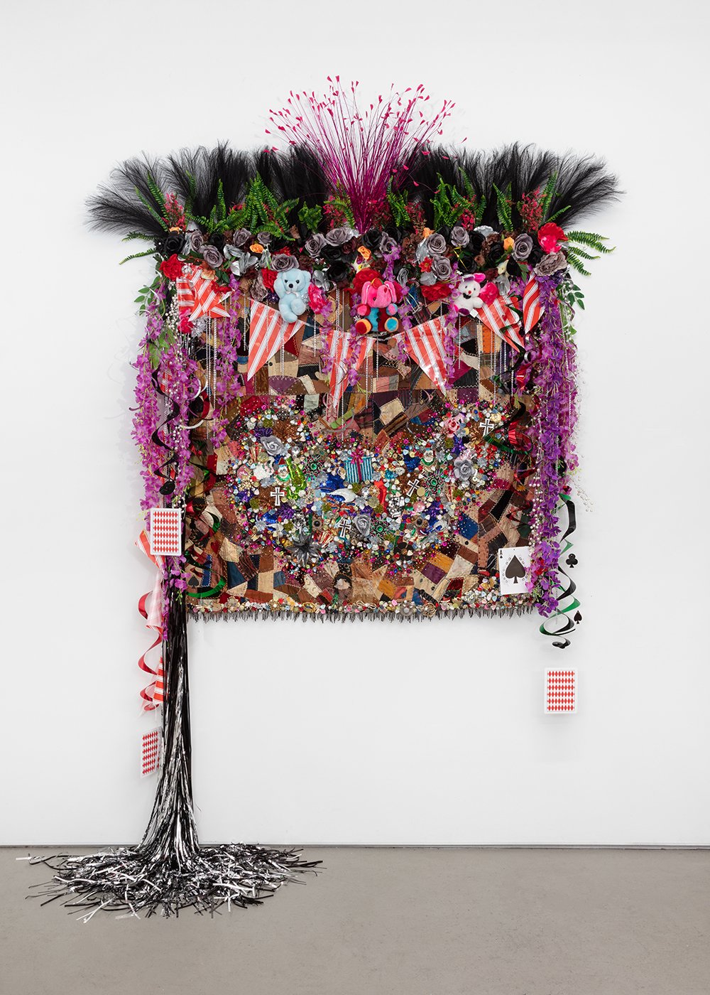  Shroud #10 , 2022, Found ‘Crazy’ quilt ca. 1890, trim, fabric flowers, streamers, banners, garland, metal chain, toys, ribbon, costume jewelry, buttons, plastic flowers and fauna, beads, sequins, thread, fabric, Douglas fir, 108 x 76 x 26” 