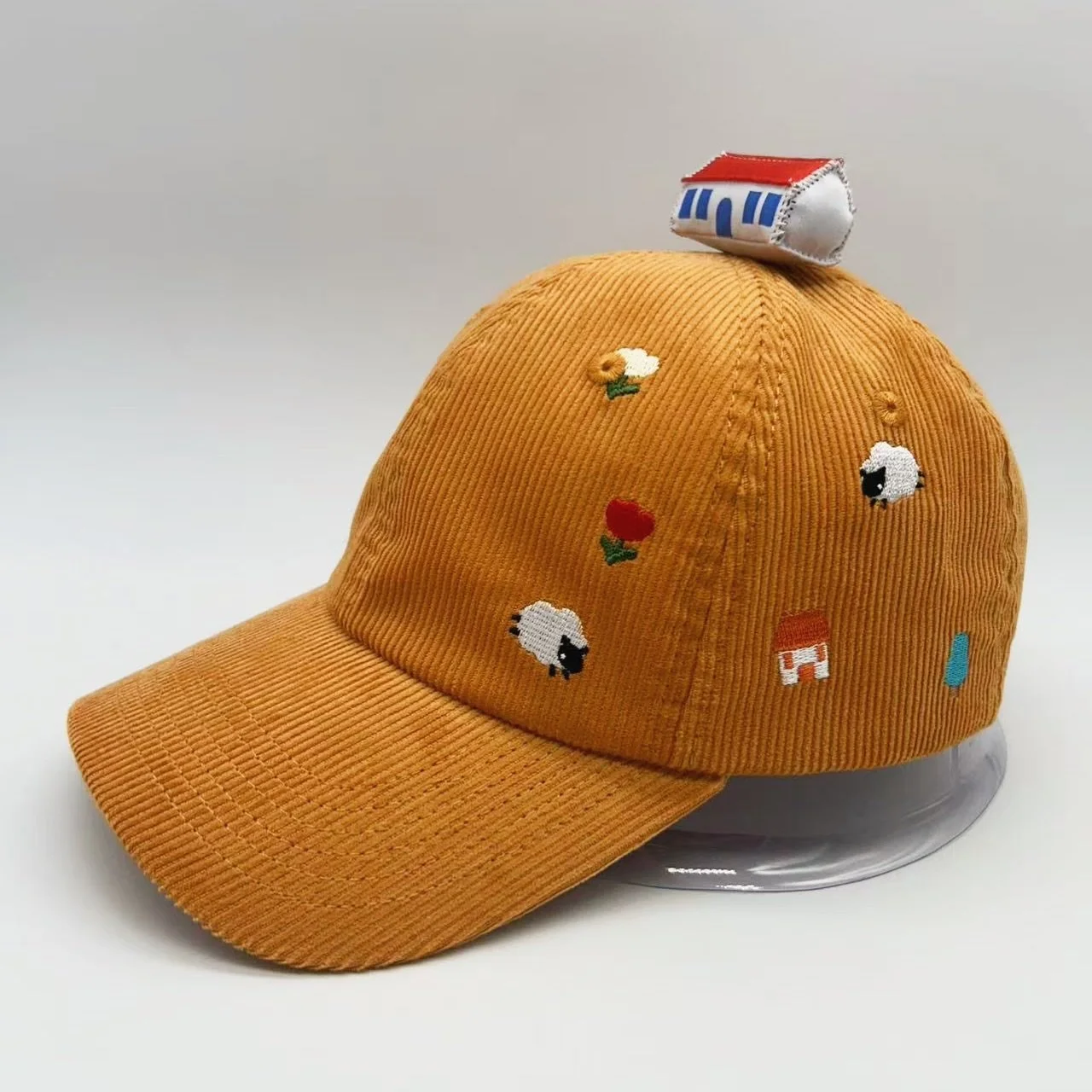 an idea i've been chipping away at the last couple months... i wanted a hat that has the concept of a house on a hill with sheep, flowers &amp; trees scattered around!! I don't love how the house looks currently so I'm trying to fix it up to look a b