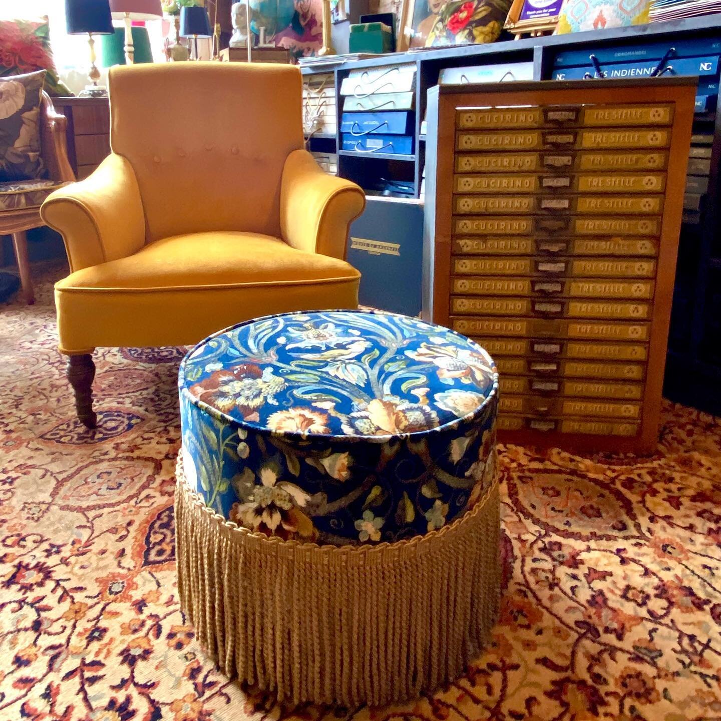 Some new arrivals in the store today... clients own chair reupholstered in Velutto Stretto velvet by @designersguild and this footstool upholstered in Gaia Midnight by @houseofhackney printed velvet with Bullion fringe - almost too good to put your f