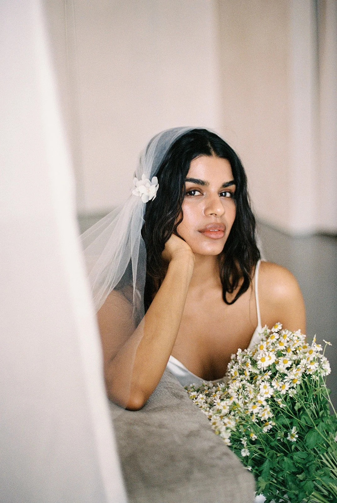 Minimal Juliet Cap Veil. 
A cap veil version of our minimal veil. Illuson tulle, finished with simple side gathers to add shape. Can we be worn with hair pins to keep it discreet, or with a choice of clips. 

Worn here with the pearl snaps clips and 