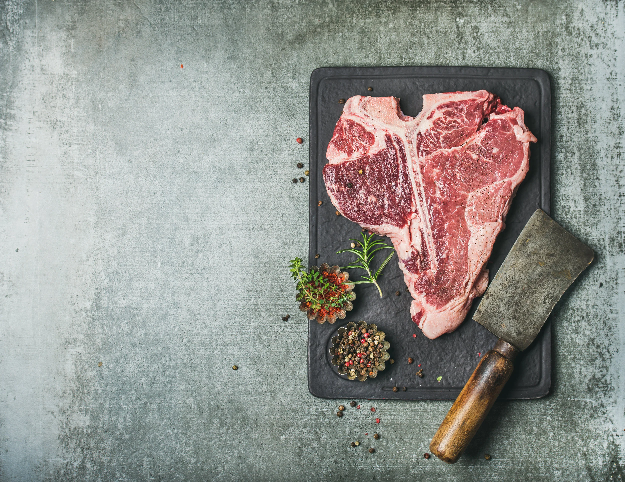 fresh-raw-beef-uncooked-t-bone-steak-with-spices-PNVSKVN.jpg
