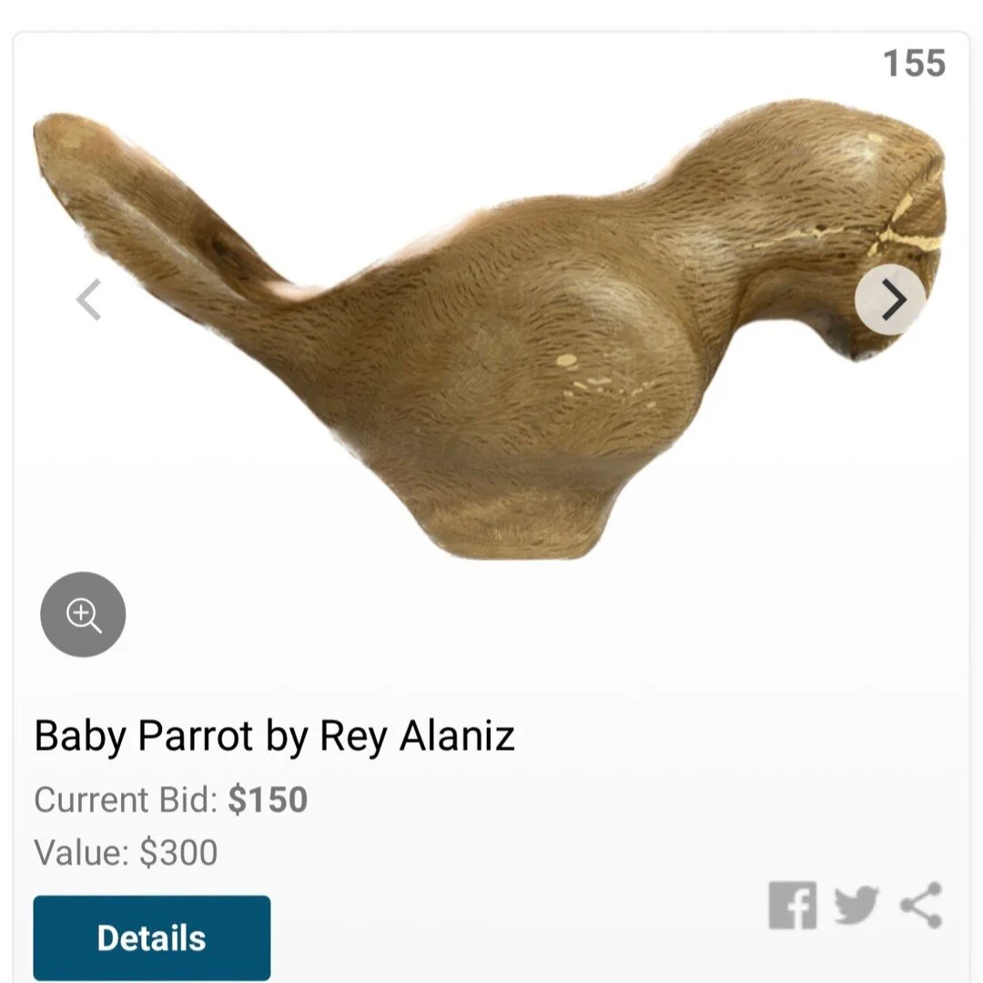 Final bid on this Baby Parrot at the Cabiet Oak auction $150.00