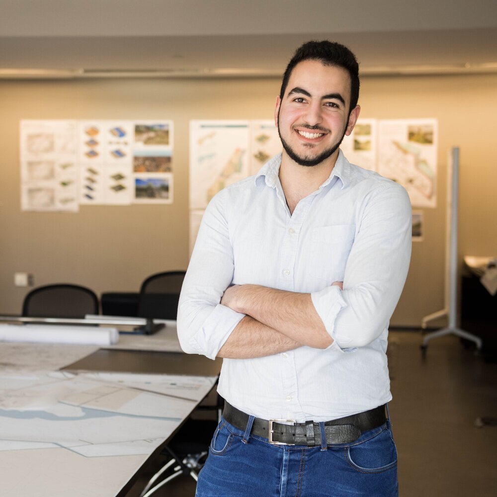 student standing in a board room