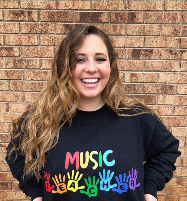 student with a music teacher shirt on