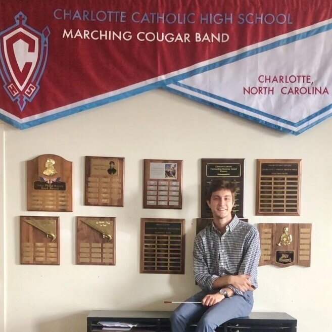 student sitting in band room