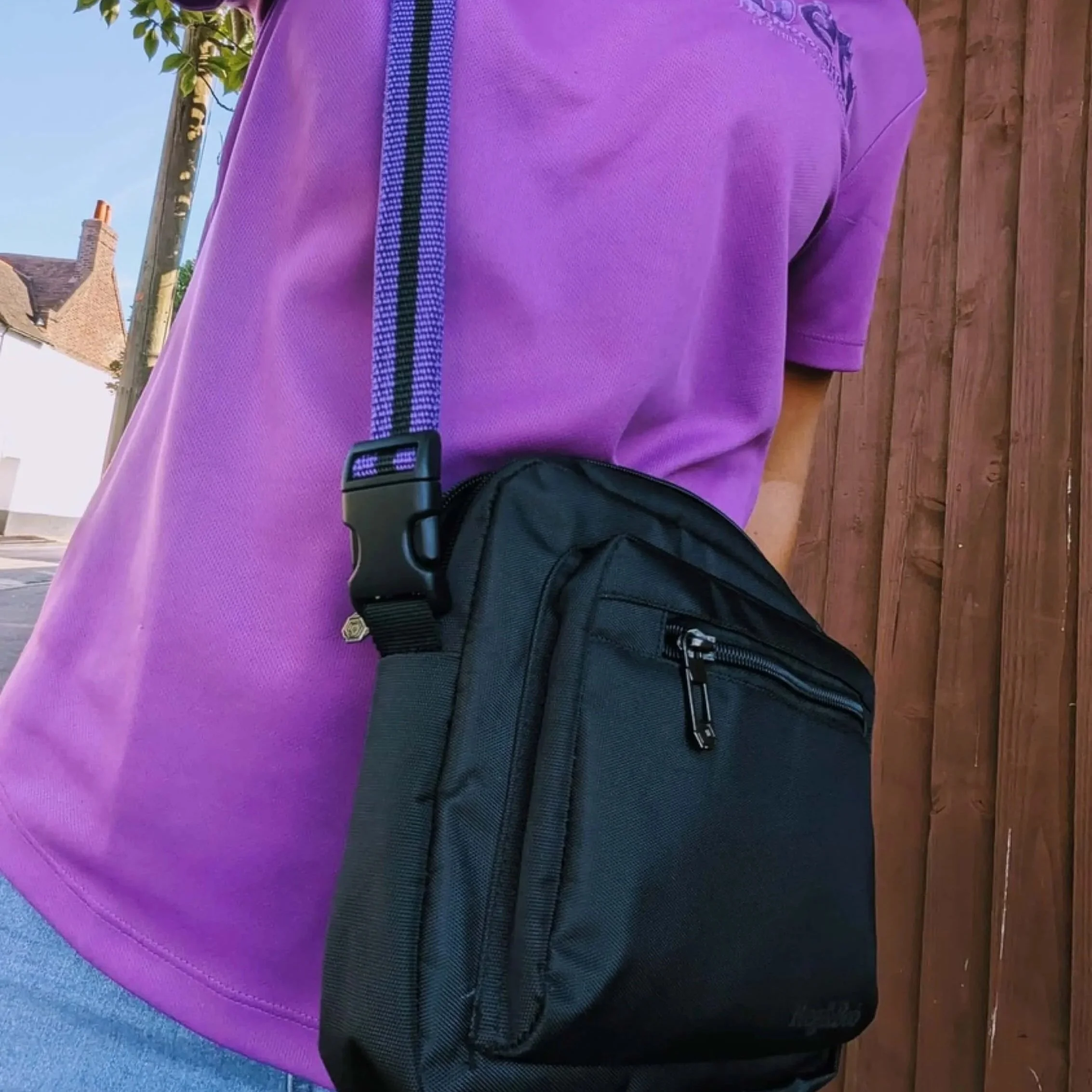 black Reg&Bob dog walking bag with purple striped strap