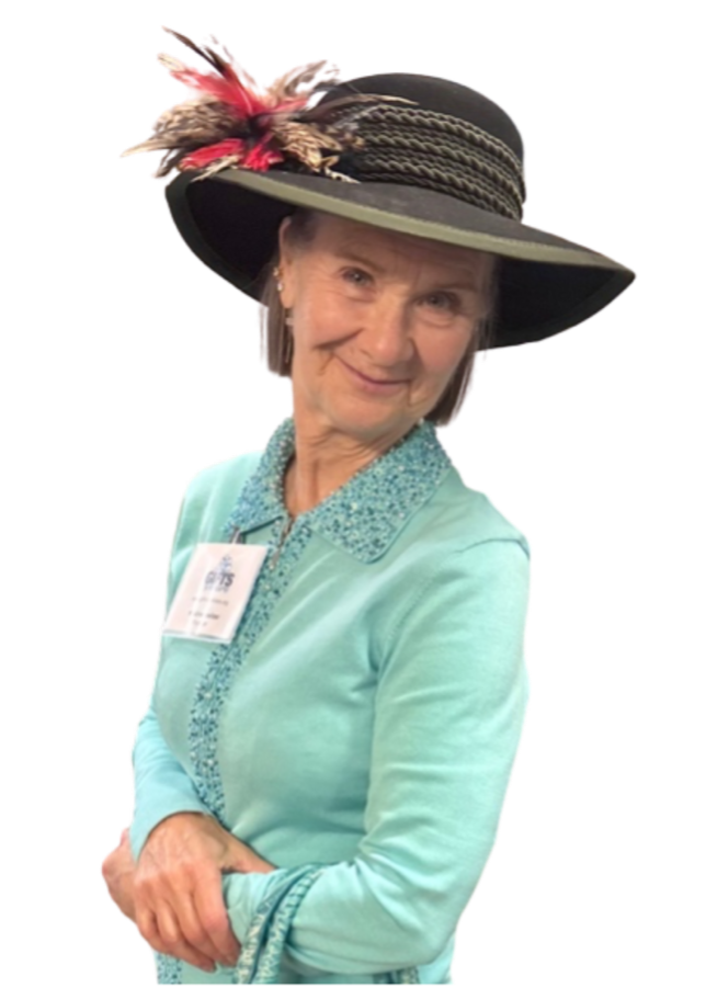 Kristine, wearing one of her hats, at the 2025-26 Gifts for Seniors kickoff party.