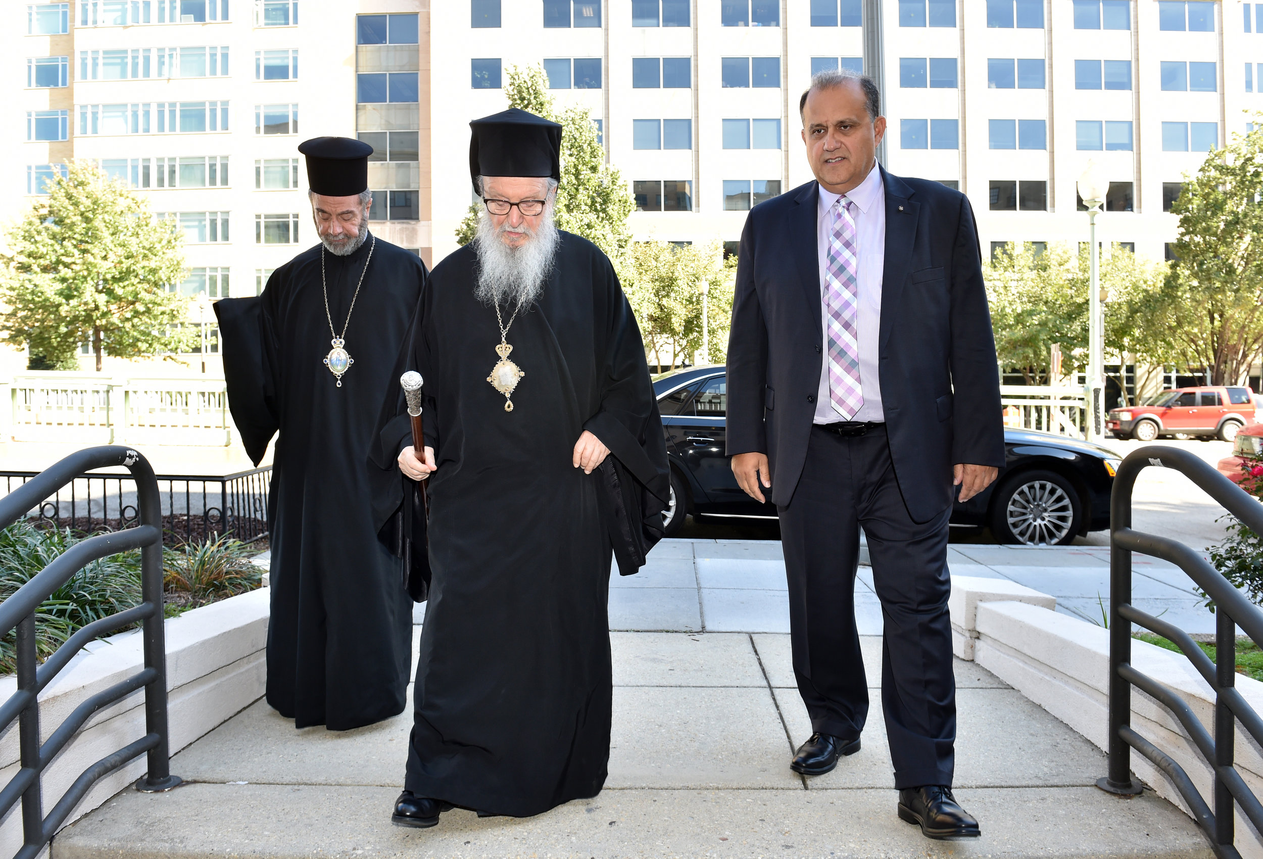  His Eminence Archbishop Demetrios, Geron of America; AHI President Nick Larigakis; and Bishop Sevastianos of Zela entering AHI headquarters, Hellenic House. 