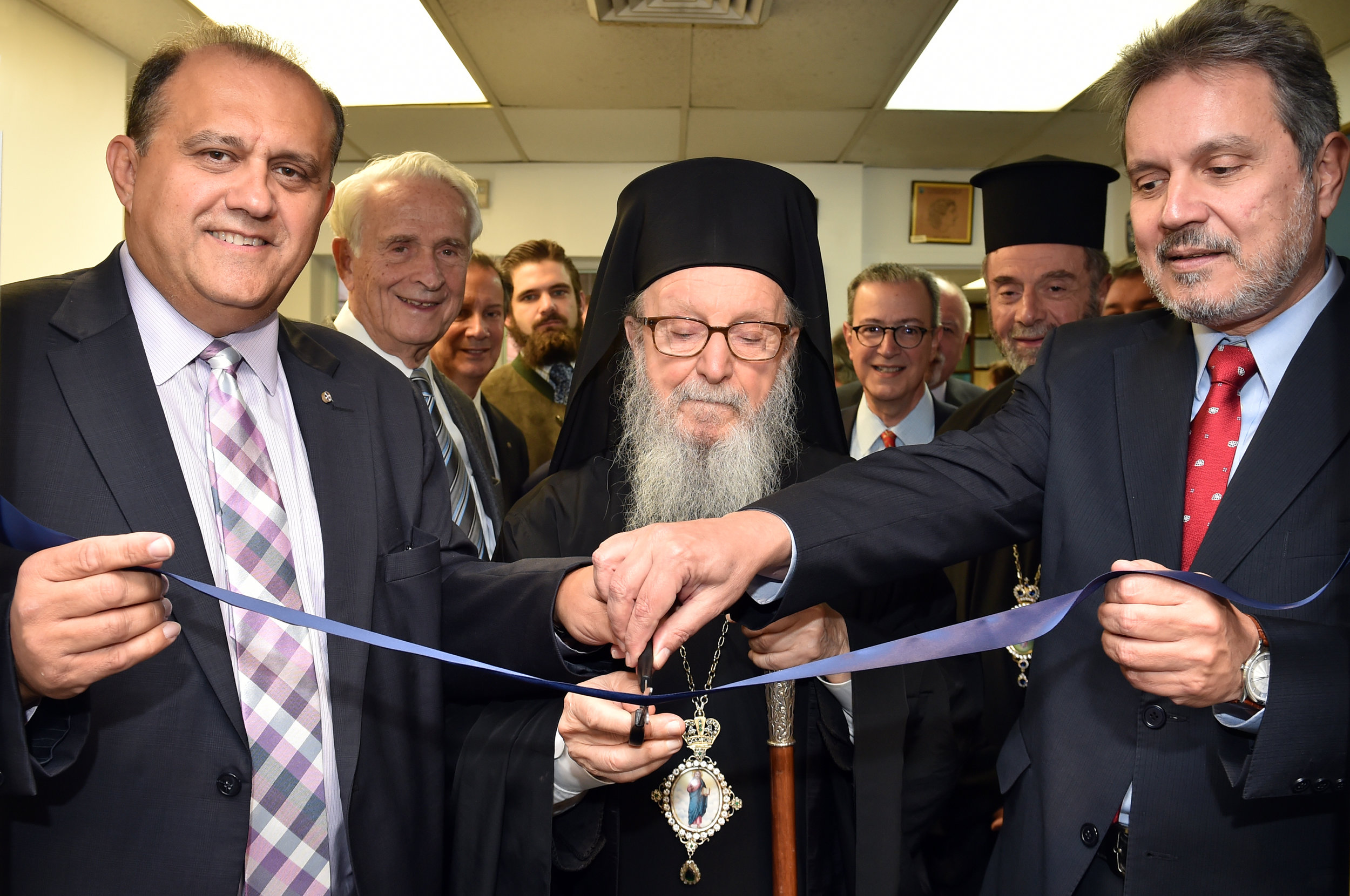 His Eminence, Nick Larigakis, and Ambassador Haris Lalacos of Greece cut the ceremonial ribbon. 