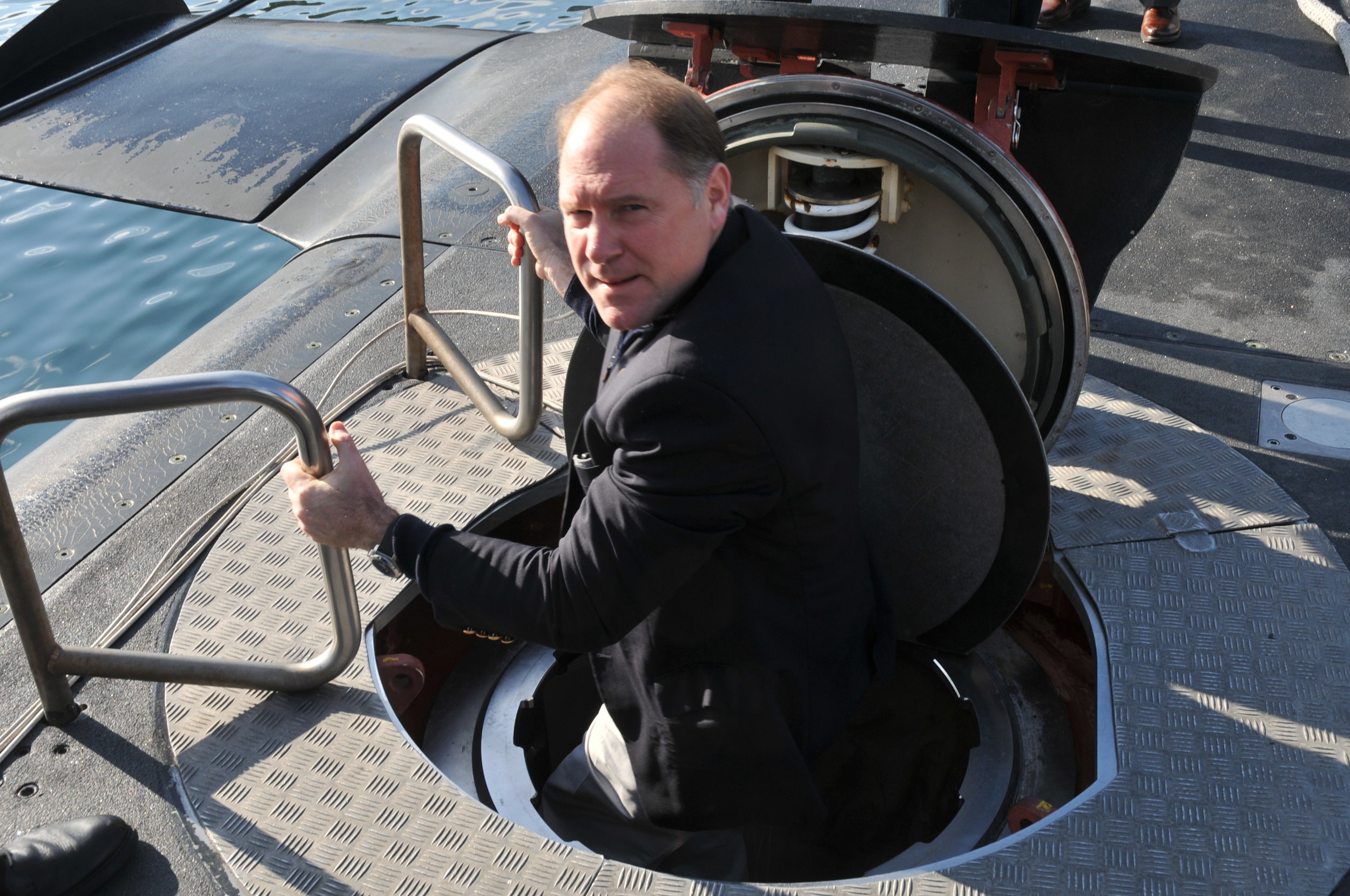  Carl R. Hollister exits from the  Submarine Papanicolis .&nbsp; 