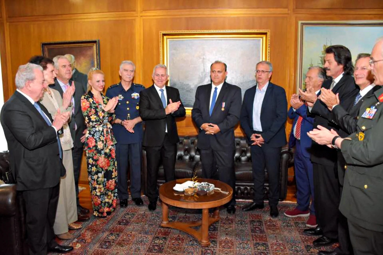 Nick Larigakis being congratulated on receiving the “Medal of Honor and Valour” from Greece’s Minister of Defense, Evangelos Apostolakis
